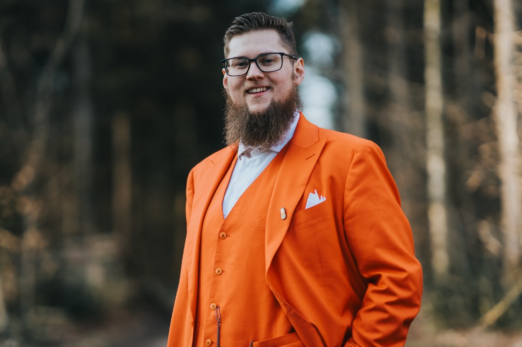 Portrait of the photographer in an orange suit