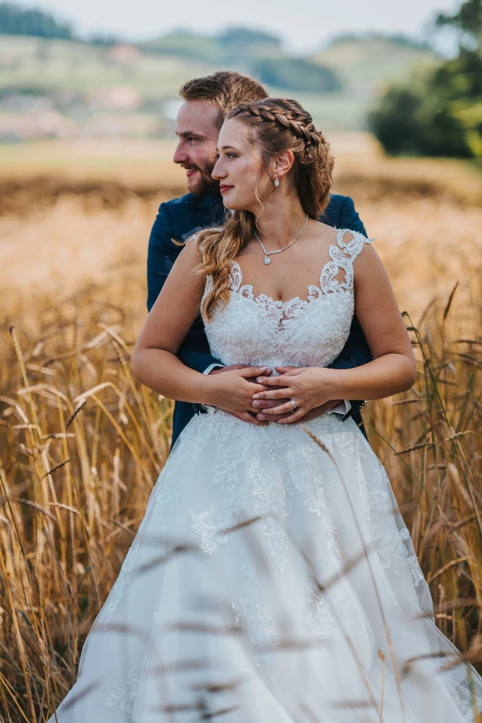 Bitcoin wedding photographer Switzerland couple portrait in golden wheat field countryside