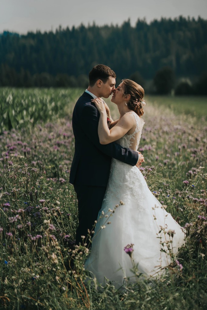 Intimate outdoor wedding couple portrait by Swiss bitcoin photographer with natural lighting